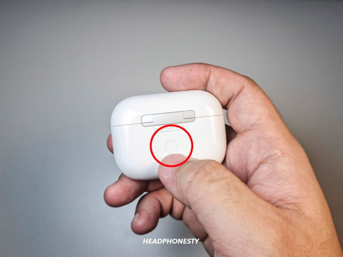 AirPods' pairing button.