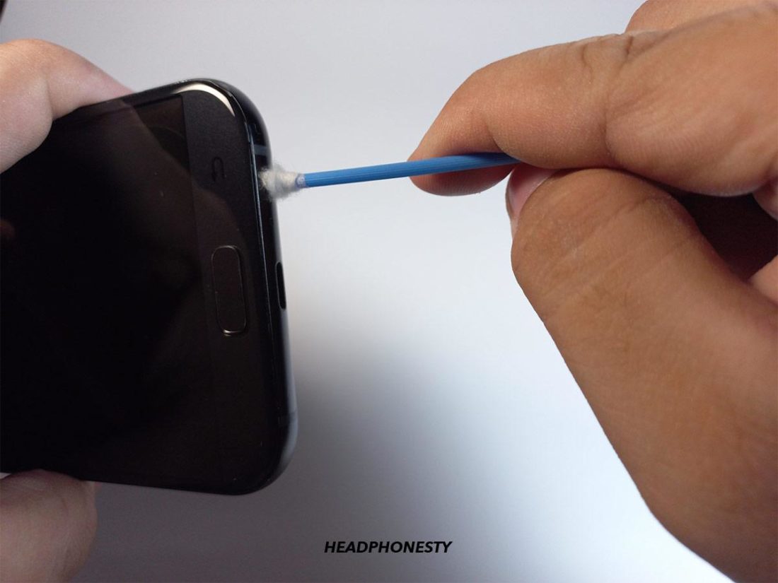 Remove the loosened-up debris from the inside of your phone's audio jack