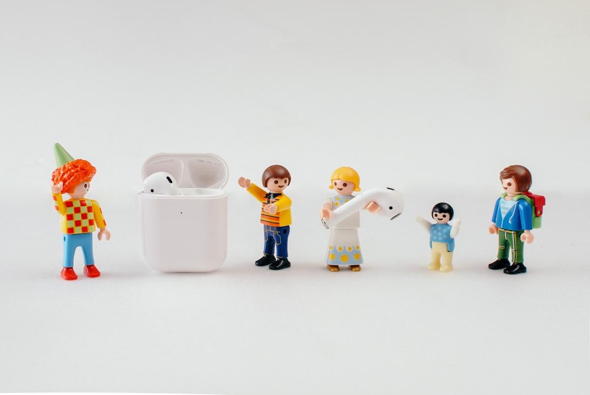 Lego figurines putting Airpods back into the charging case