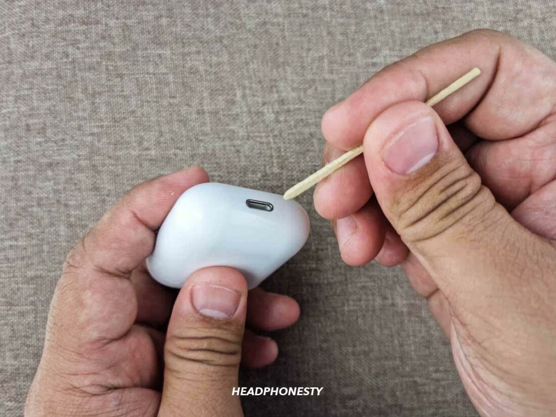 Clean the charging port of the case using toothpick