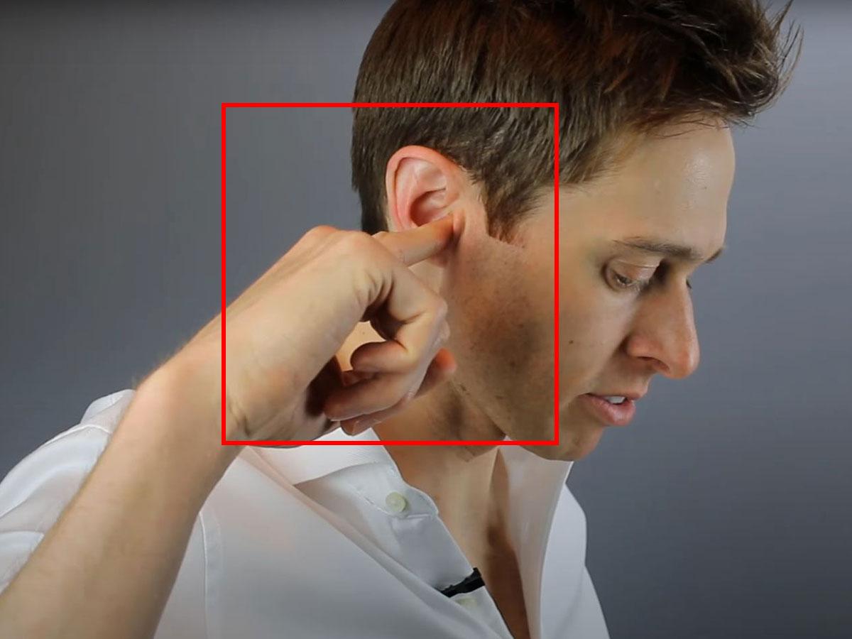 Pushing earplugs inside the ear (From: YouTube/Doctor Cliff)
