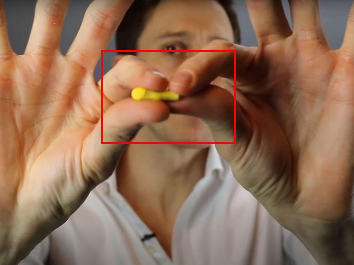 Roll up the ear plugs using your fingers. (From: YouTube/Doctor Cliff)