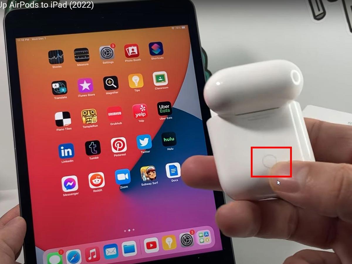 Showing button on the back of AirPods (From: Youtube/Technomentary)