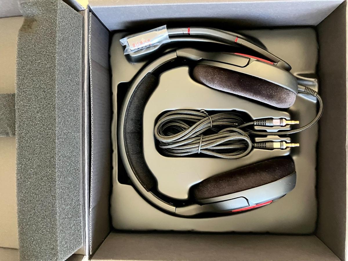 Open box displaying the packaged headset and cable.