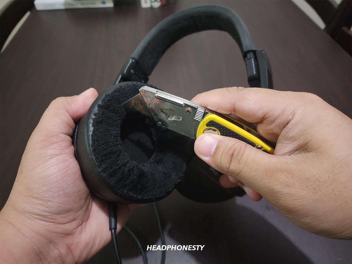 Cutting a gap through the ear cushion of headphones