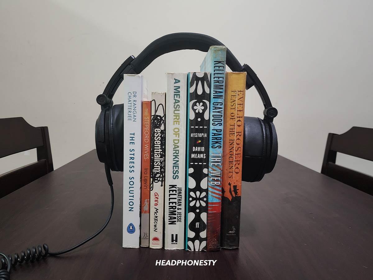 Stretch your headphones over a stack of books.