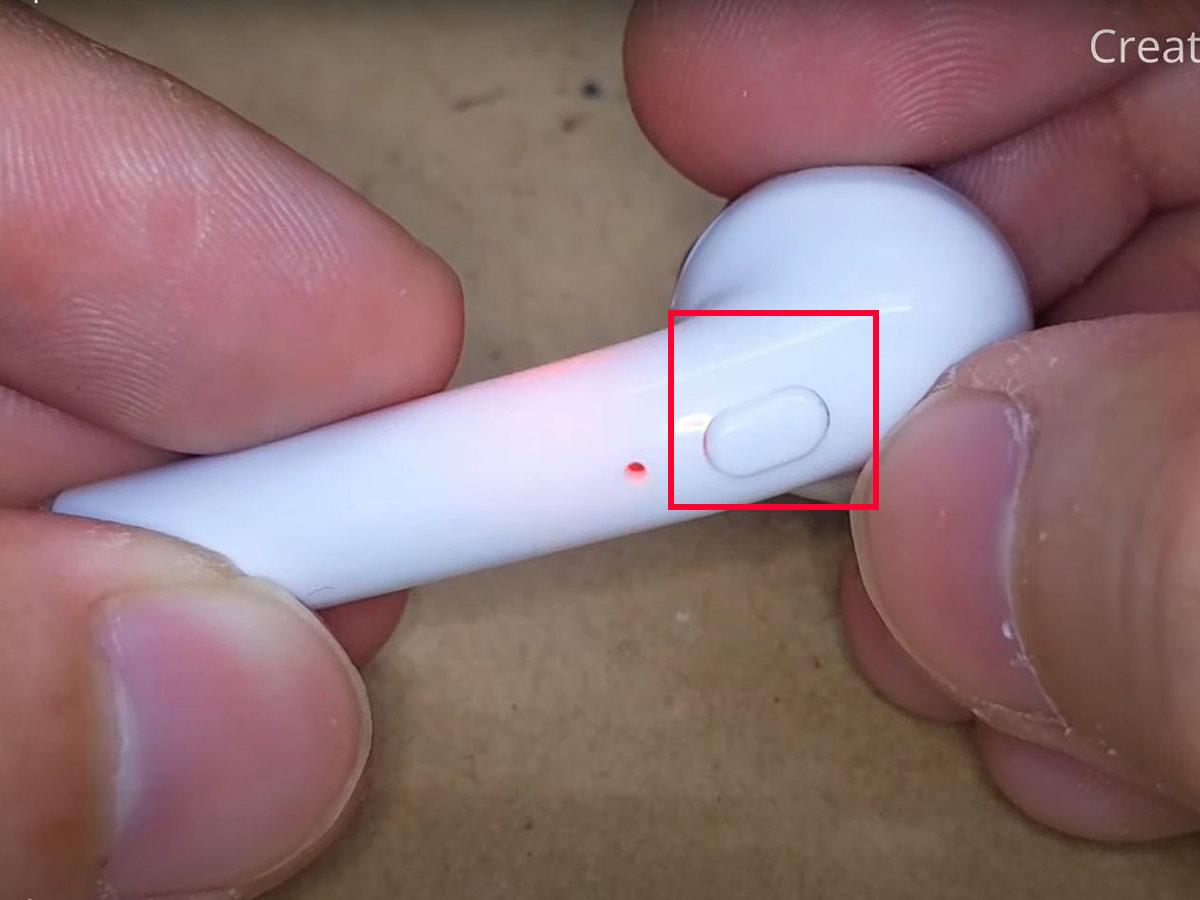 Turn on the Bluetooth earbuds by pressing the power button. (From: Youtube/Creative & Duck)