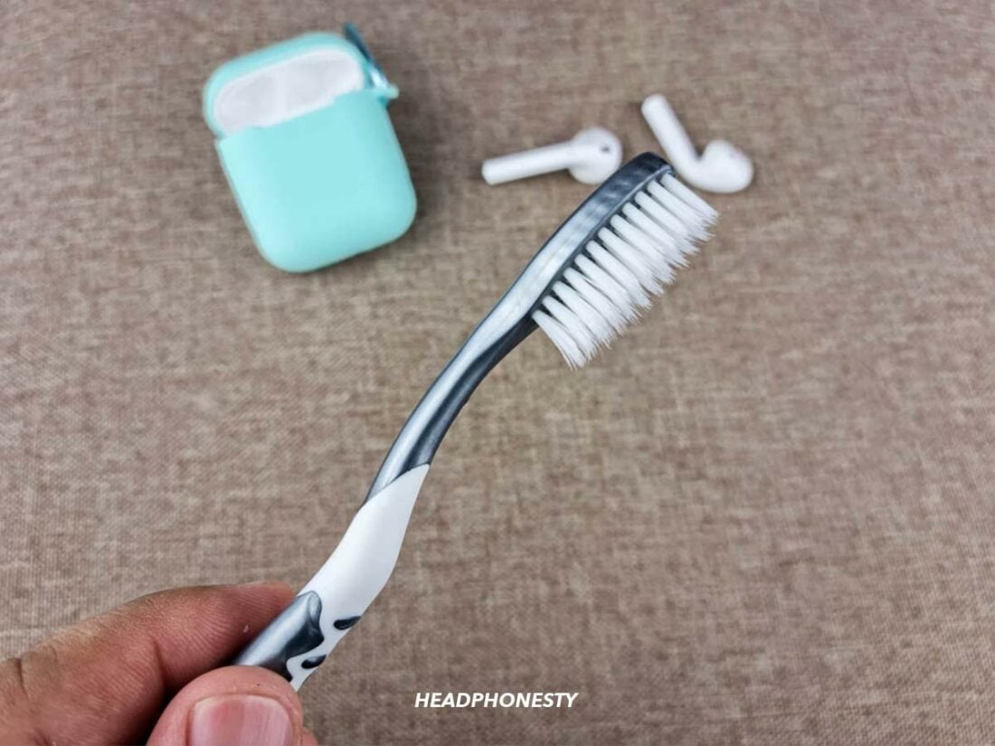 Use a soft-bristled toothbrush to clean the lightning port at the bottom of the charging case.