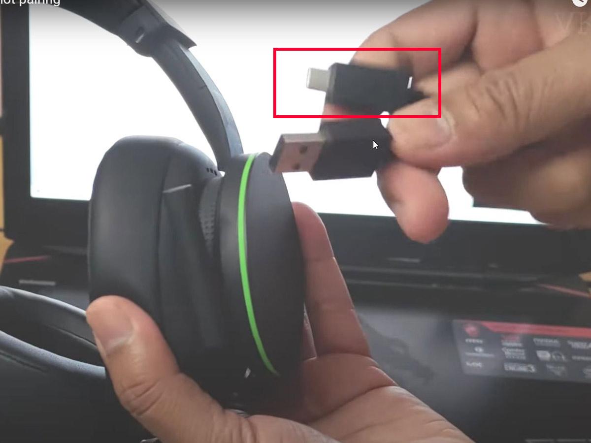 Insert the USB-C cable into the headset . (From: YouTube/Vicky's Blog)
