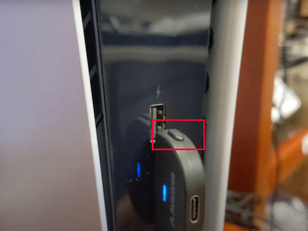 Press the adapter’s pairing button. (From: YouTube/Avantree)