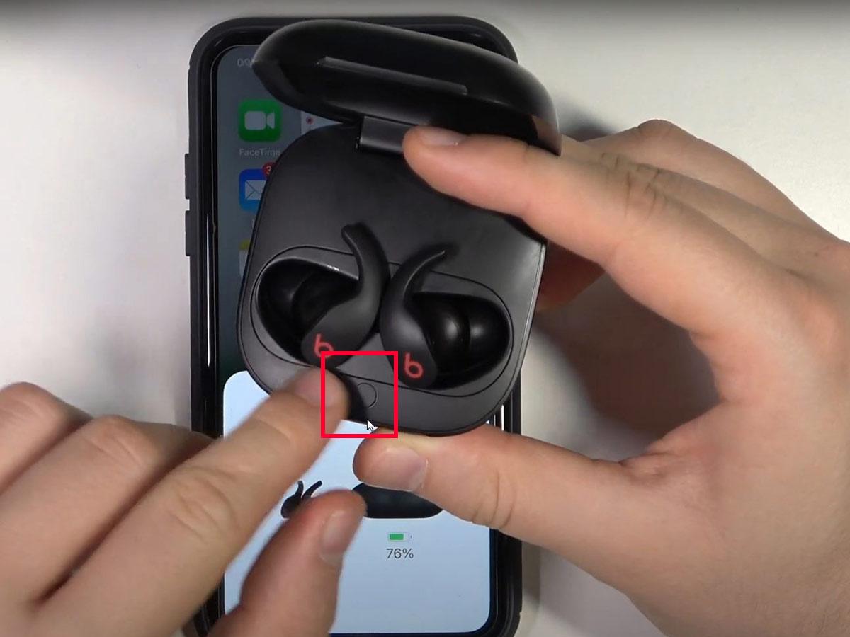 Hold the system button inside the case for about fifteen seconds. (From: YouTube/HardReset.Info)