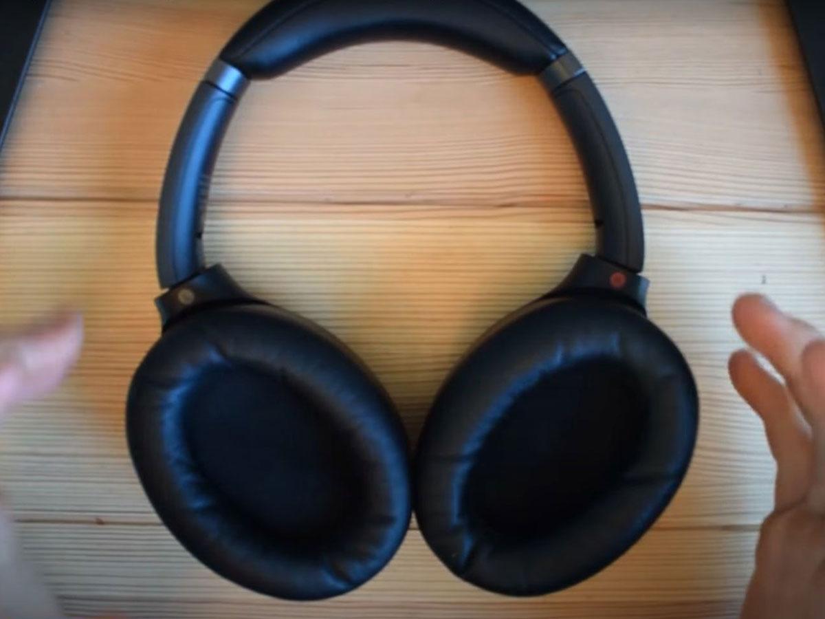 Sony headphones on a flat surface with the ear pads up. (From: Youtube/Jon Tries to Fix Things)