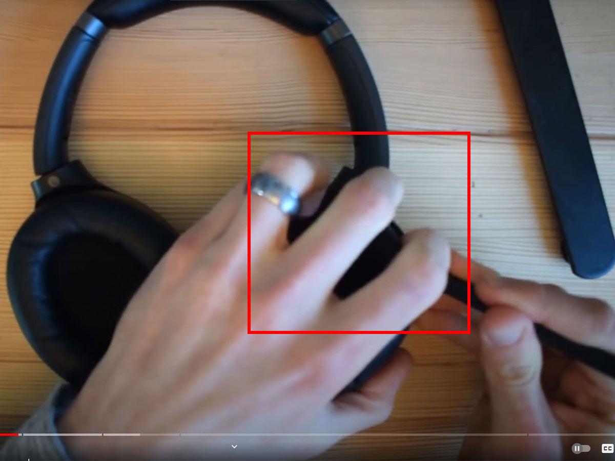 Remove the ear pads on left ear cup. (From: Youtube/ Jon Tries to Fix Things) 