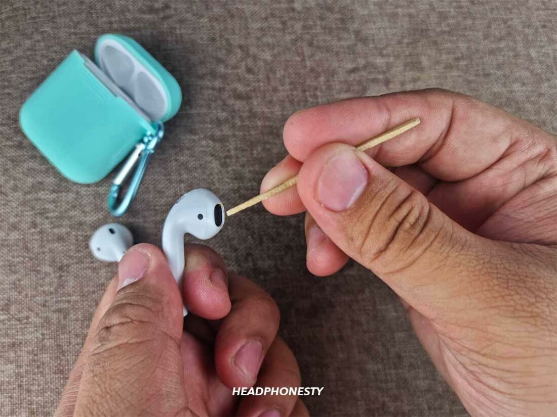 Further clean the AirPods using a toothpick