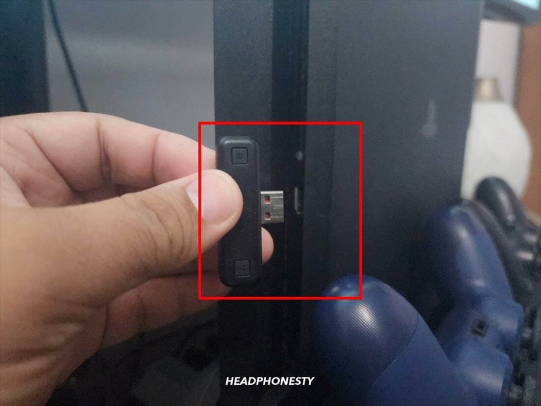 Plug the Bluetooth adapter into one of the free USB ports on your PS console.