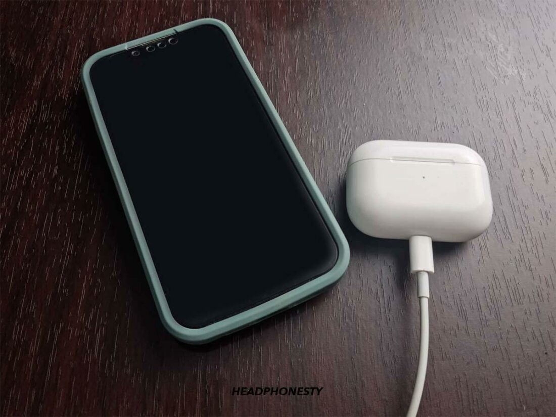 Connect your iOS device to the internet. Then, place it beside the charging case.