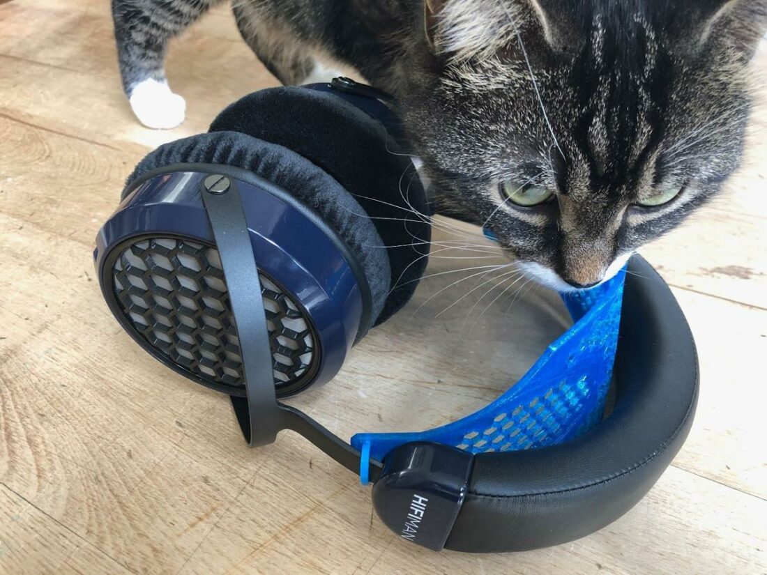 I tried a 3D-printed add-on comfort band intended for Audeze headphones. The cat is unsure.
