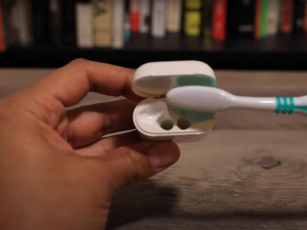 Clean dirt from the case contacts with a soft toothbrush. (From: Youtube/Insider Tech)
