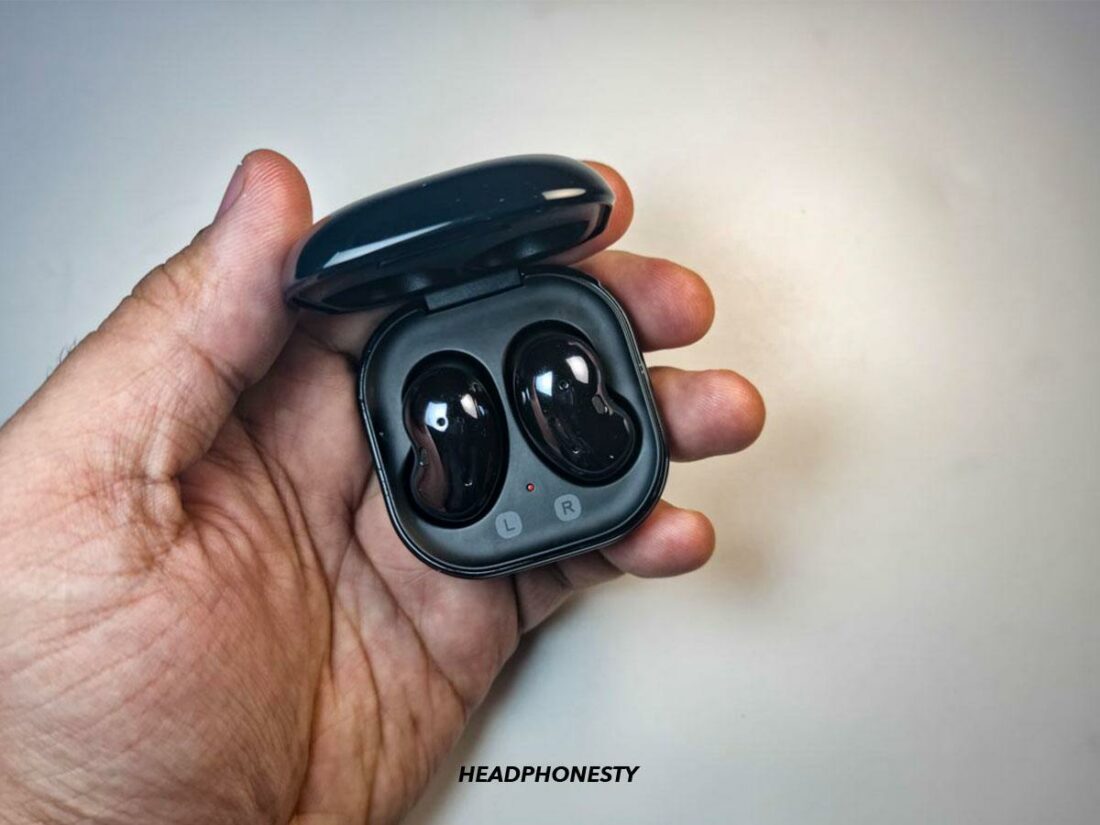 Place both earbuds in the charging case.