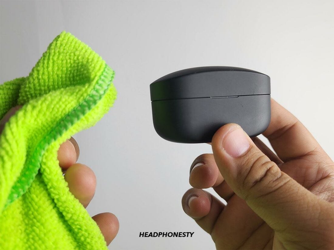 Wipe the exterior surfaces of the earbuds’ case.