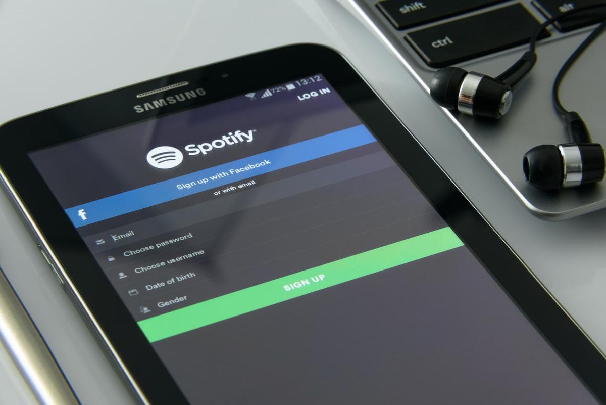 The Spotify mobile app on a tablet (From: Pexels).