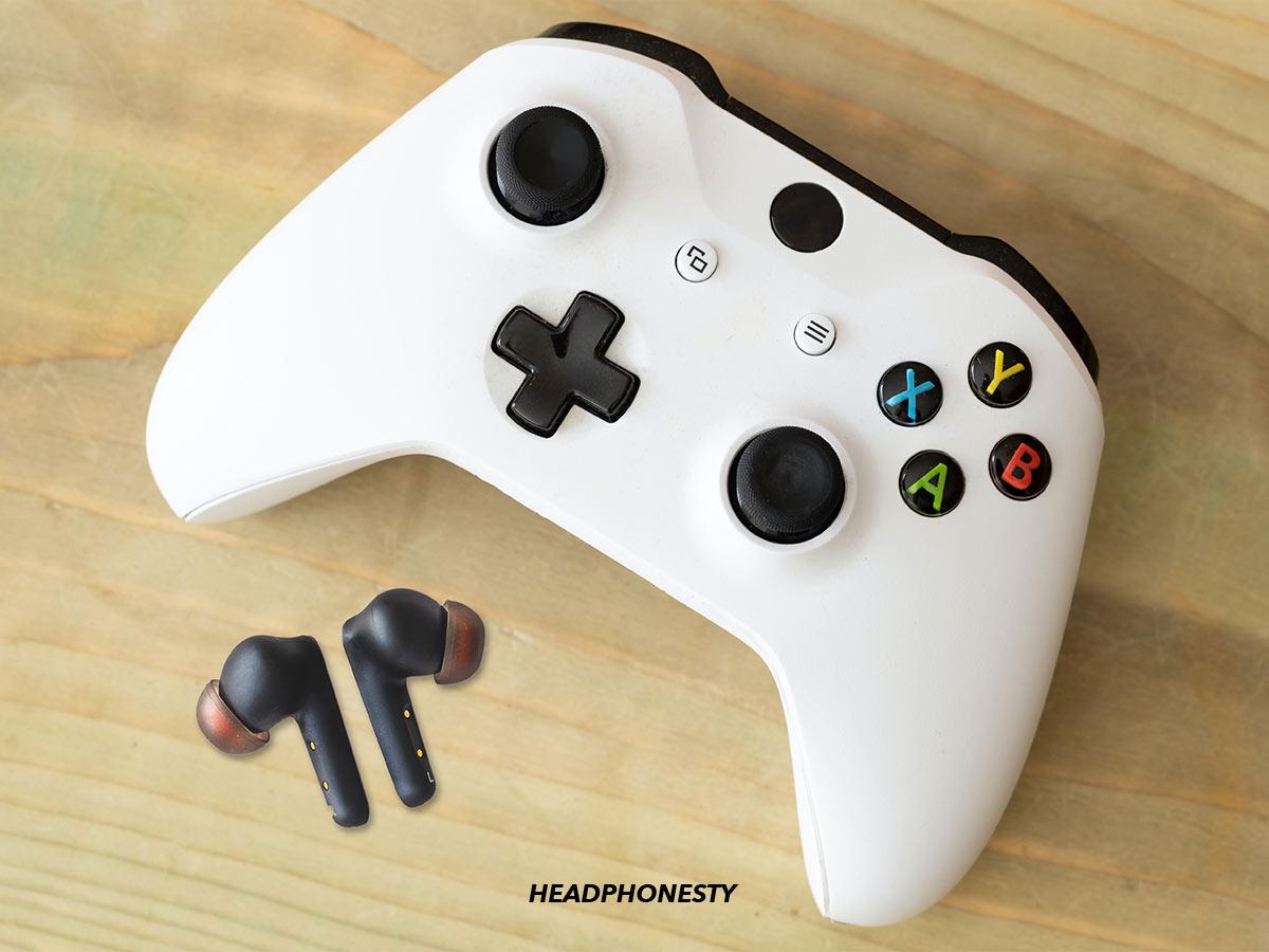 Wireless earbuds and an Xbox controller.
