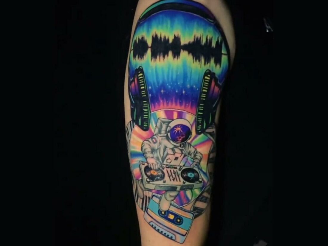 Colorful astronaut DJ tattoo. (From: Instagram/slootattoos)