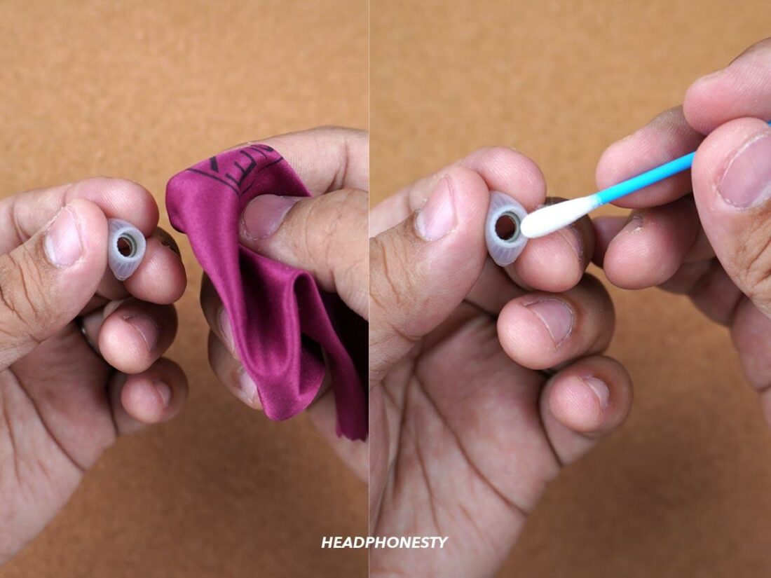 Using a dry lint free cloth and cotton swab to clean the ear tips.