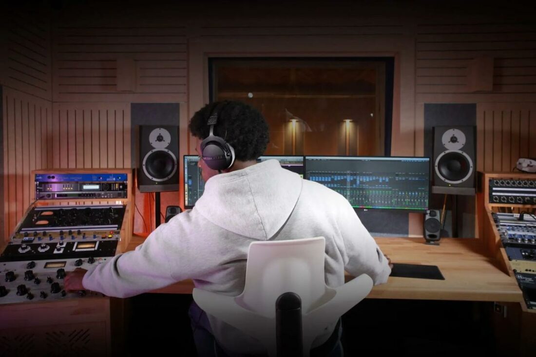 Man wearing the DT 770 Pro X Limited Edition headphones while working in a studio. (From: Beyerdynamic)