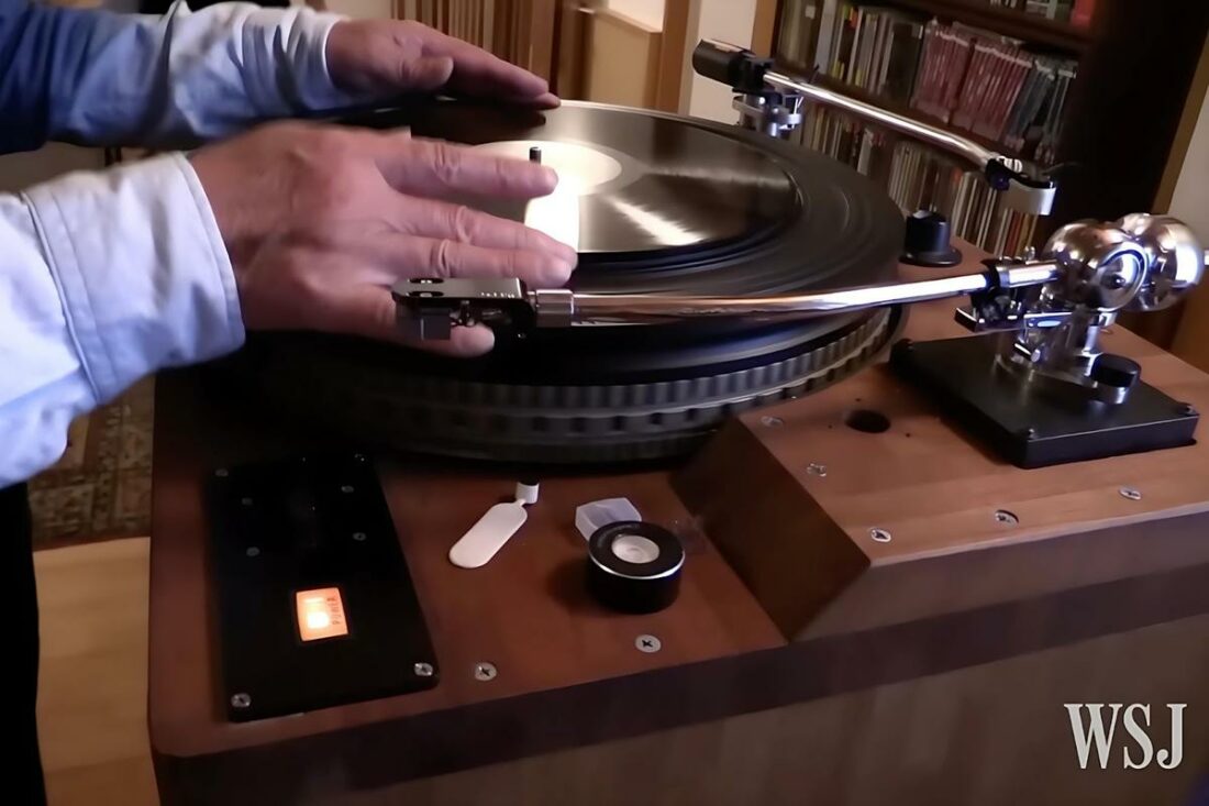 He tests the changes after installing the pole using a Queen vinyl. (From: WSJ)