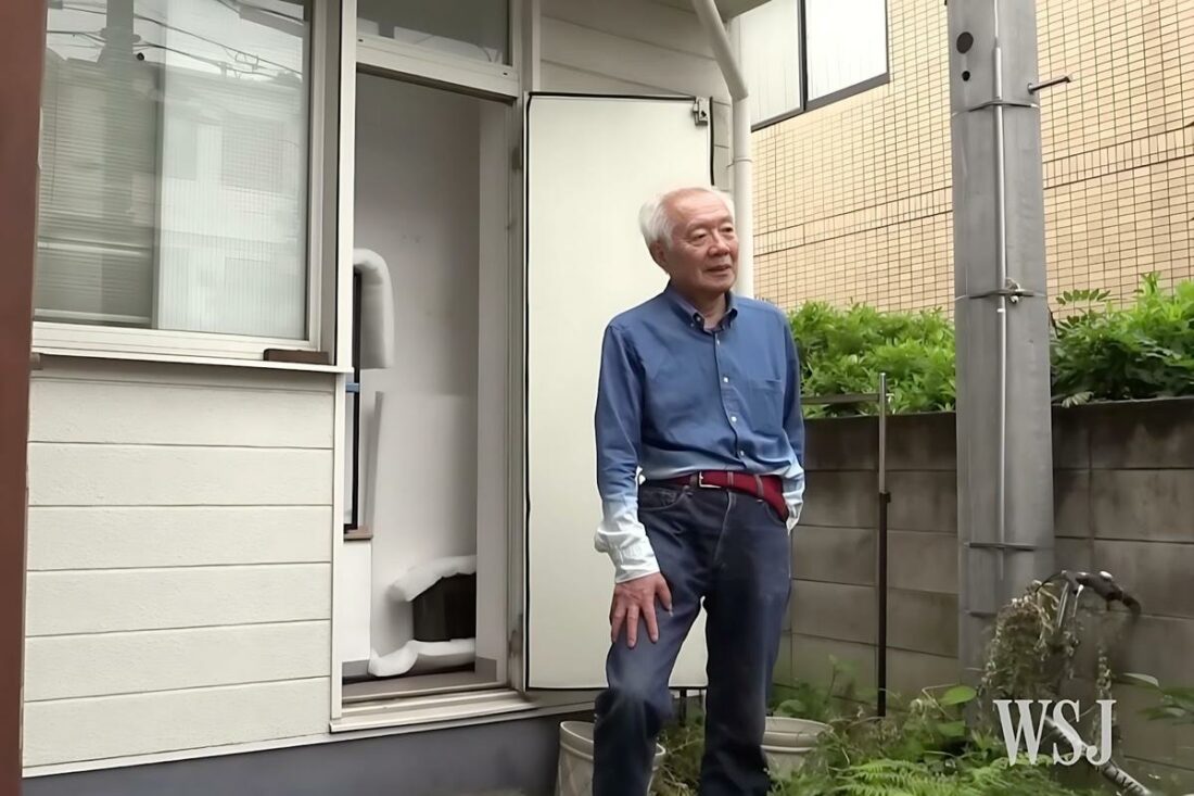 Morita, standing beside his personal utility pole in his front yard. (From: WSJ)