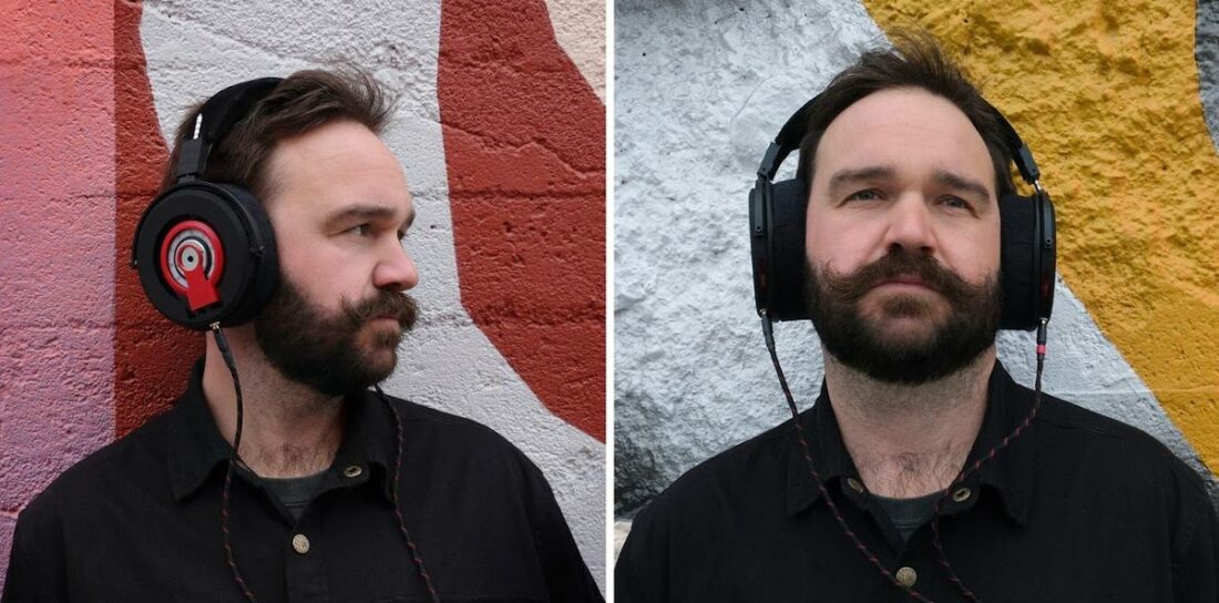 Man wearing the DMS Project Omega Headphones. (From: Headphones.com)